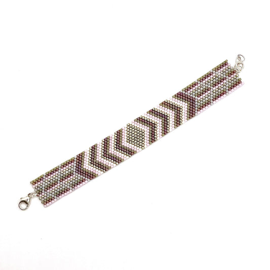 Flat beaded bracelet woven with silver, mauve, and gray tiny beads. A fun and stylish beach or pool accessory.