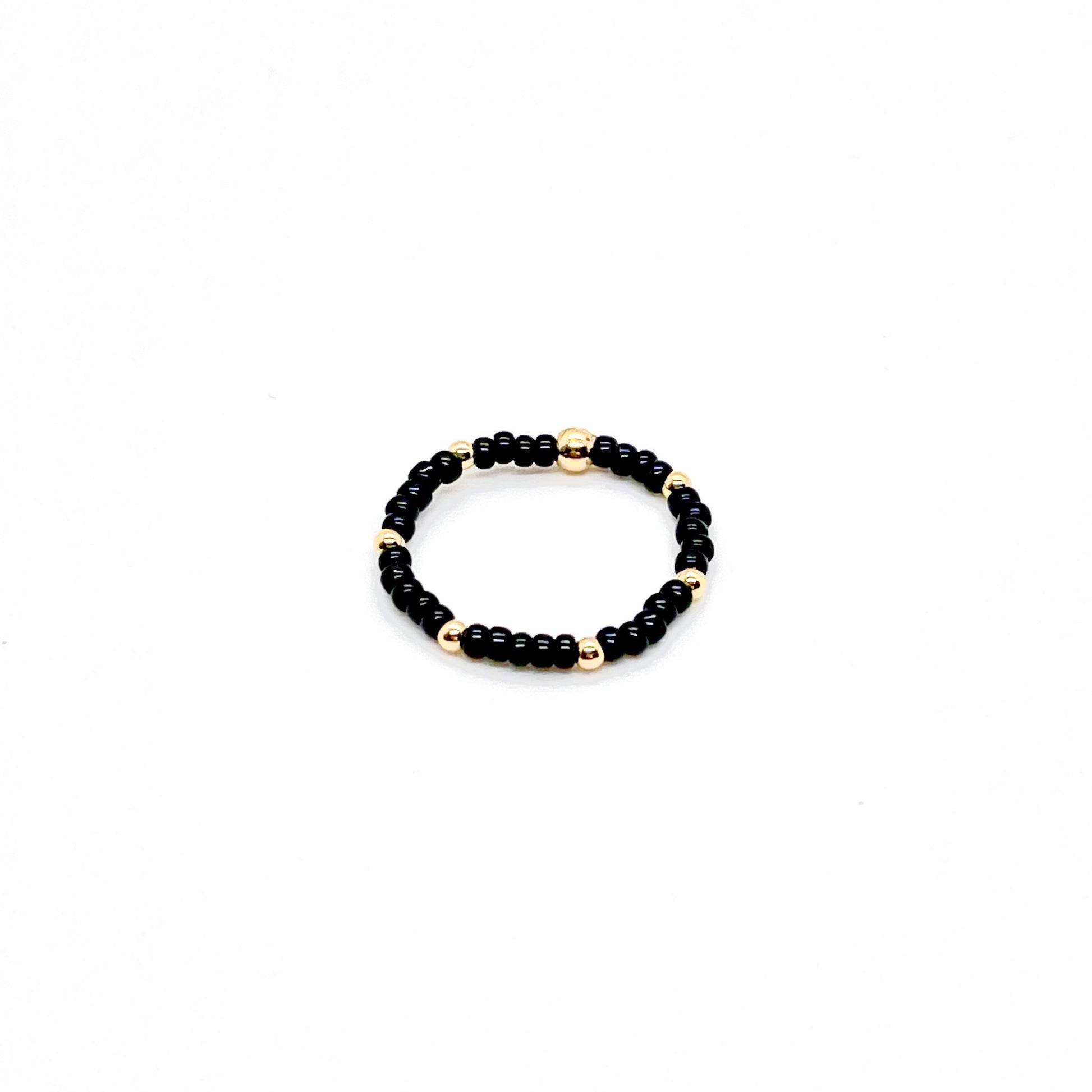 Stretch ring | Black seed bead ring with 2mm 14k gold filled accent ball beads.